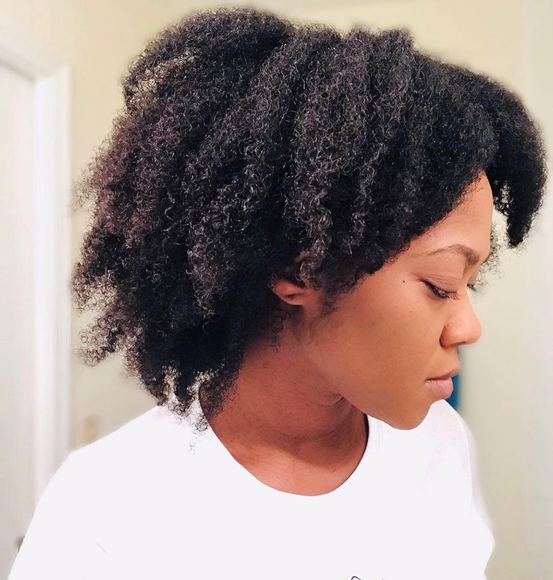 Nickie showing her hair before using Curls Dynasty products.