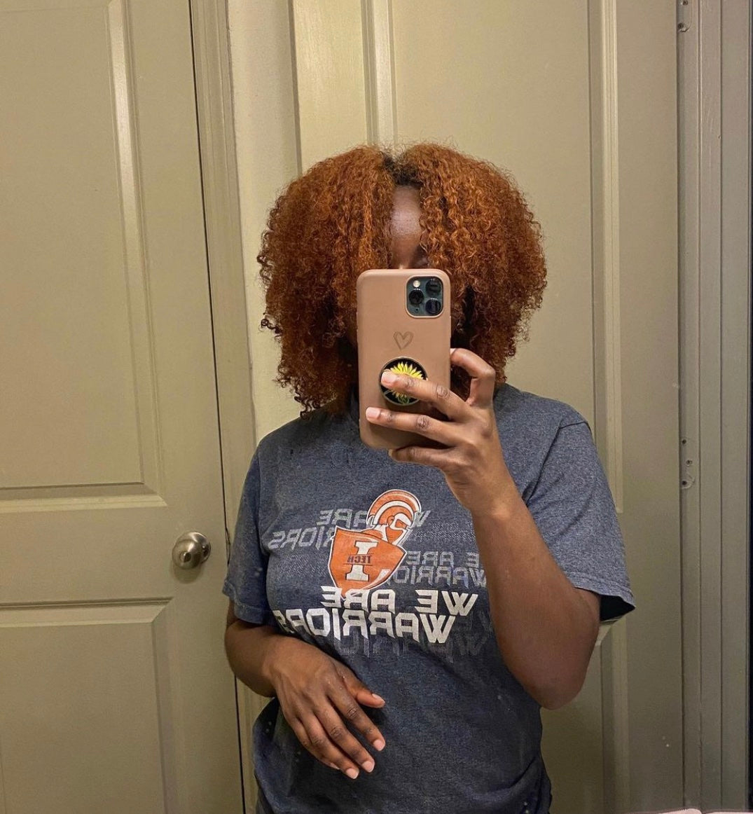 Toshia showing her hair after using Curls Dynasty products.