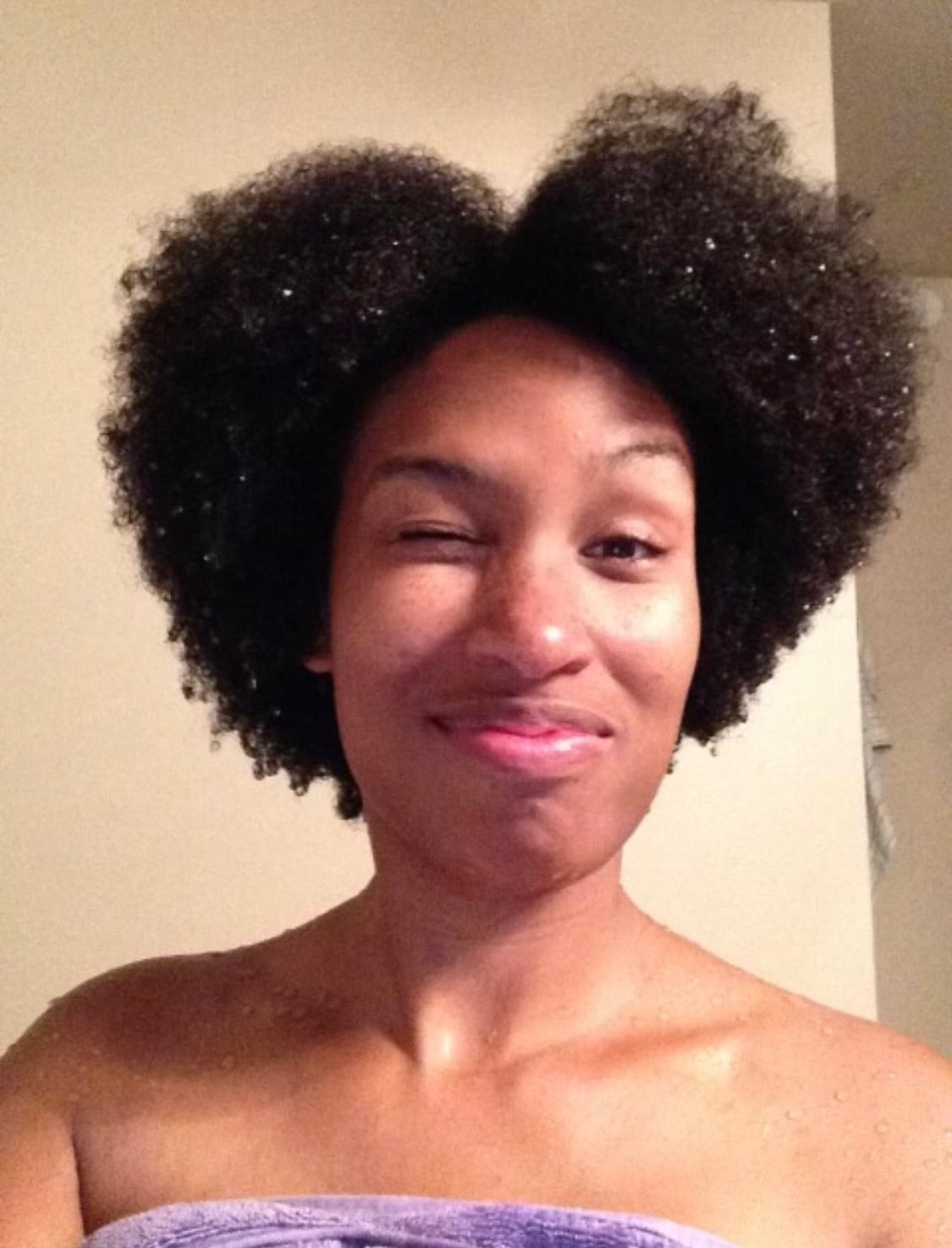 Valerie showing her hair after using Curls Dynasty products.