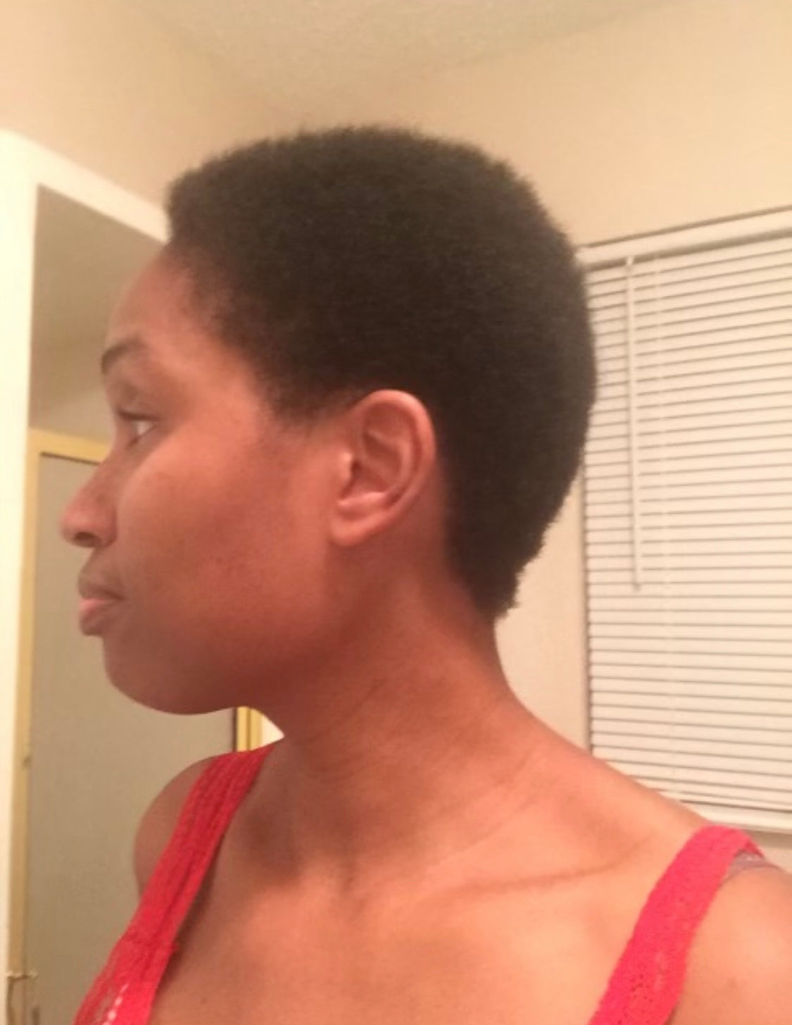 Valerie showing her hair before using Curls Dynasty products.