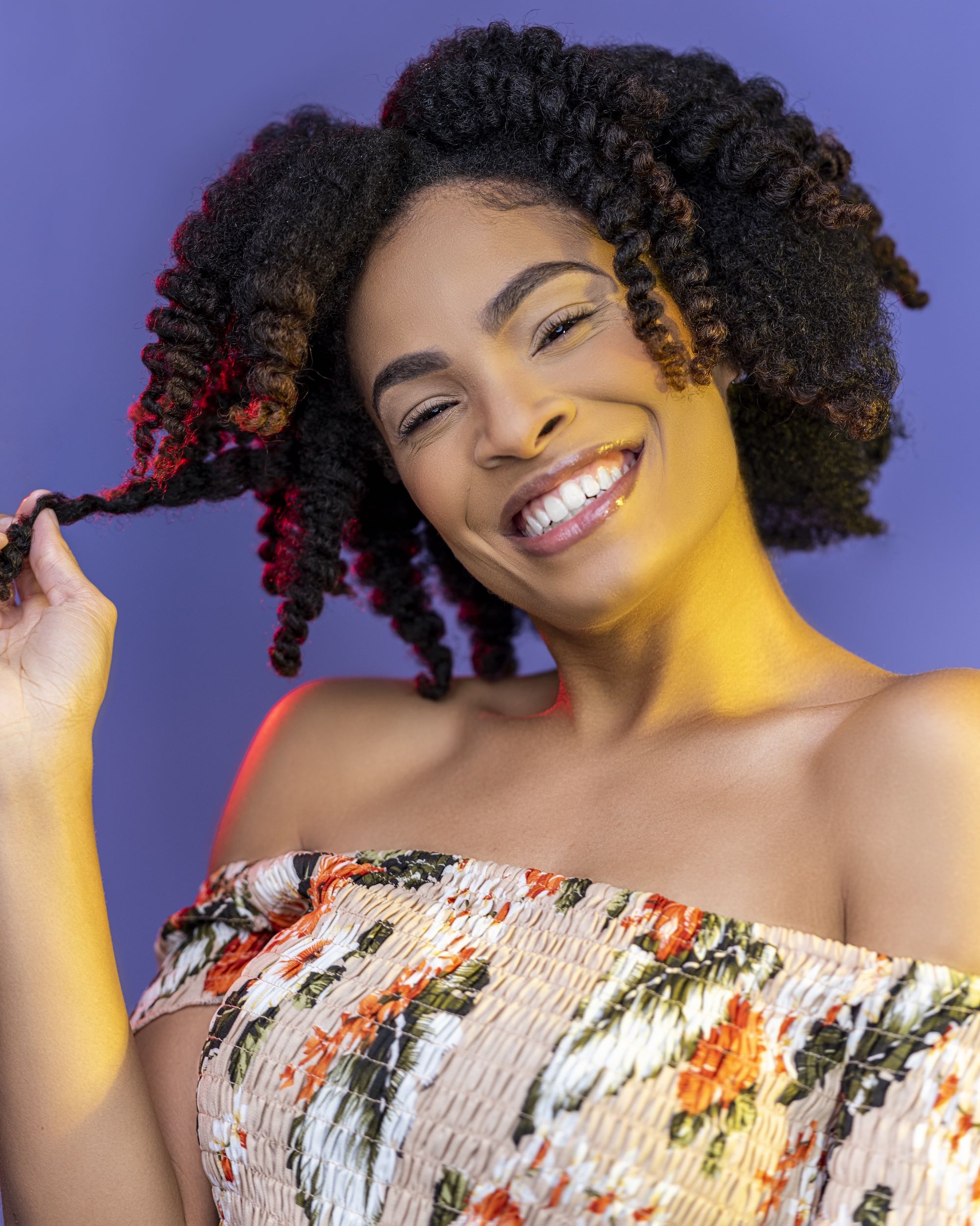 Yoki showing her hair after using Curls Dynasty products.