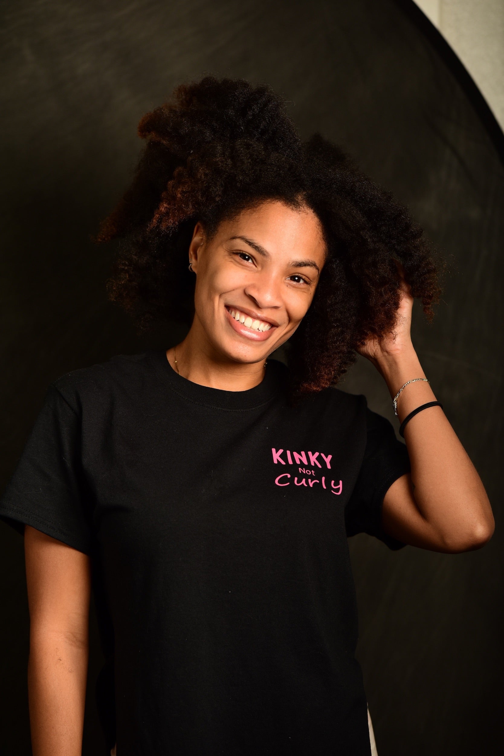 Yoki showing her hair before using Curls Dynasty products.